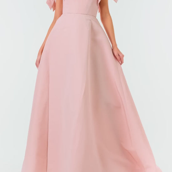 Monique Lhuillier Fall 2024 off the shoulder bow sleeve gown in pale blush faille with full skirt and high leg slit - video.