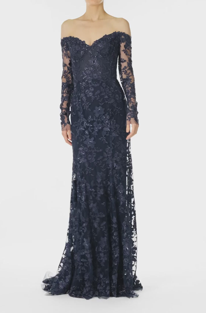 Monique Lhuillier Spring 2025 Off the shoulder, long sleeve trumpet gown with sweetheart neckline in Lapis/Noir re-embroidered tulle - video.