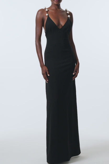 Monique Lhuillier Spring 2026 Noir Lightweight Silk Wool Suiting A - line V -neck gown with pearl ball straps -video.