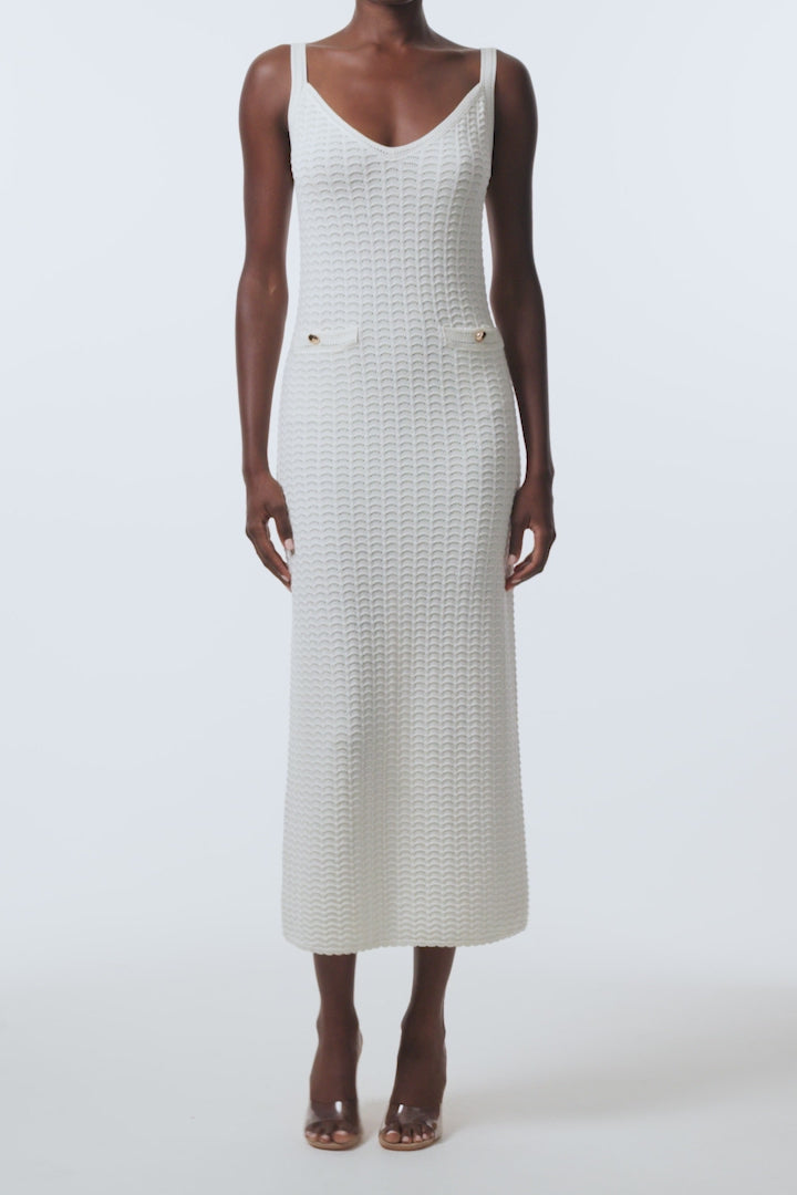 Monique Lhuillier Spring 2026 Ivory Cotton Viscose Knit Lace stitch sleeveless dress with gold buttons - video.