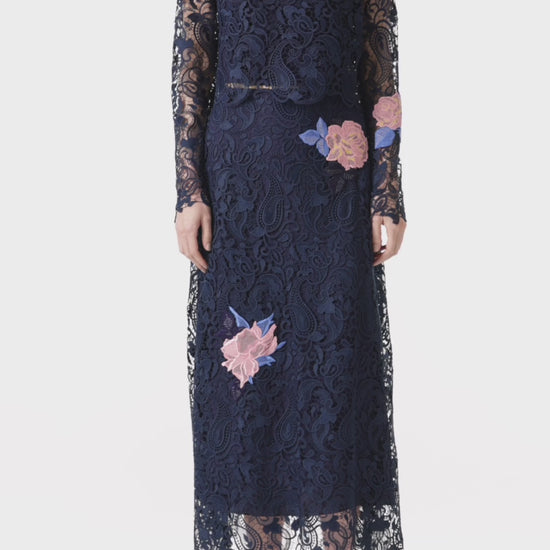 Monique Lhuillier long sleeve navy lace top with pink lace flowers.