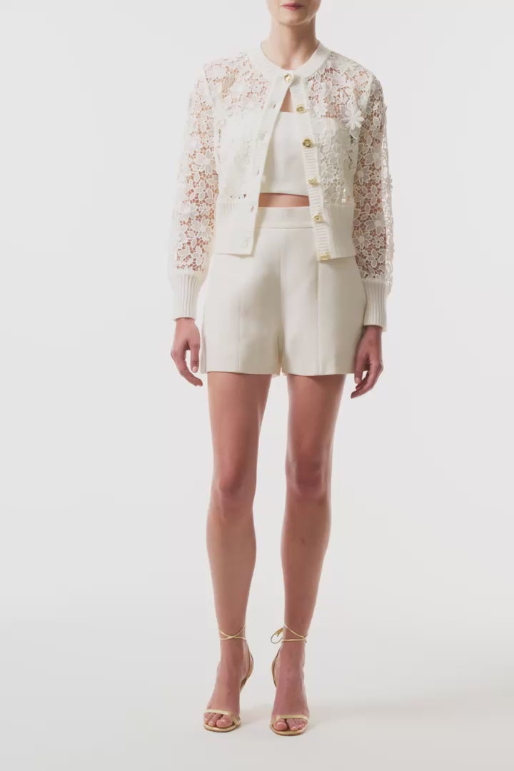 Monique Lhuillier Spring 2025 silk white lace cardigan with gold buttons - video.