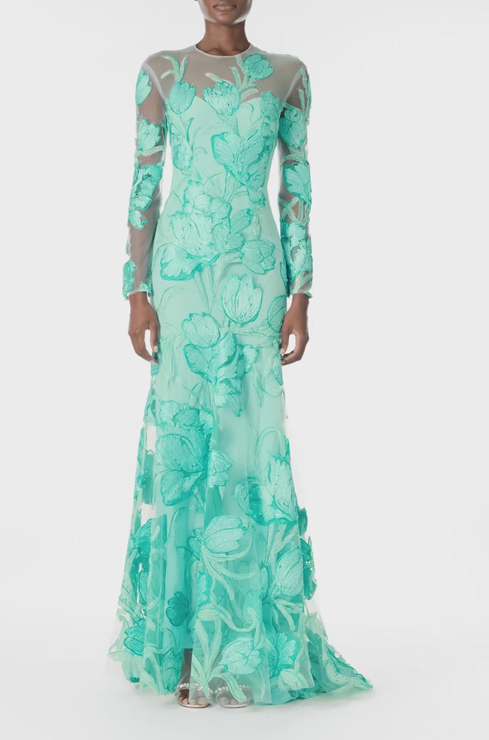 Monique Lhuillier Spring 2025 Embroidered, aqua floral tulle long sleeve trumpet gown with jewel neckline - video.