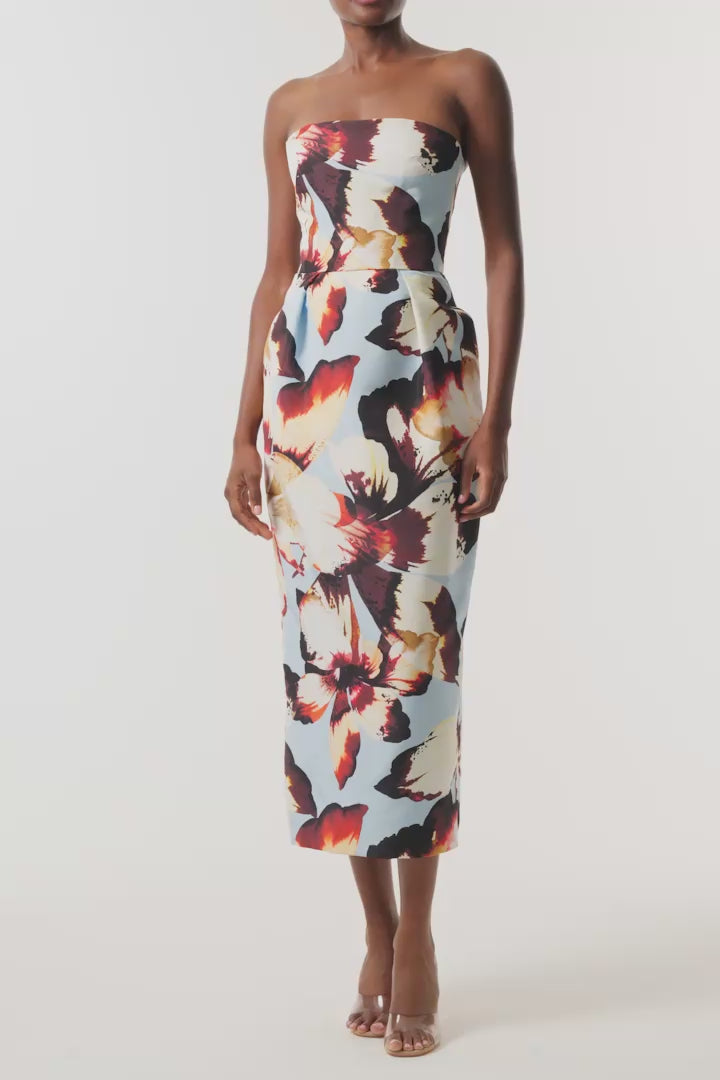 Monique Lhuillier Fall 2026 Pale Blue Amber Lily Printed Faille strapless pleated cocktail dress with pockets - video.