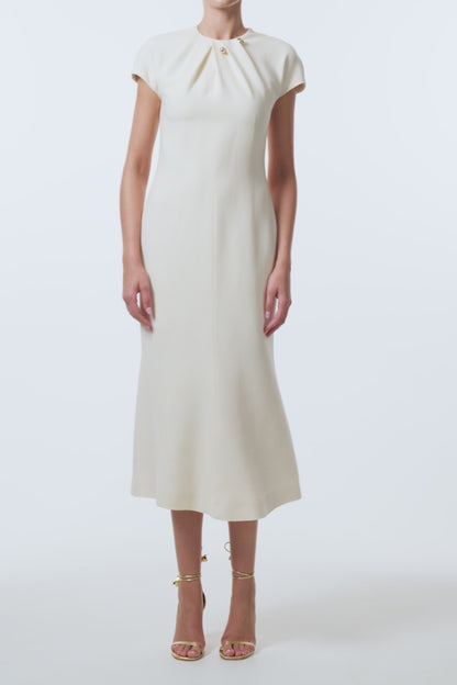 Monique Lhuillier Spring 2026 Ivory Lightweight Silk Wool Suiting Draped neckline dress with gold ball piercing - video.