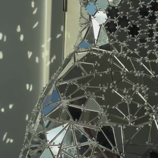 Monique Lhuillier Fall 2025 strapless mini dress in silver mirrored embroidery - detail reel from Instagram.