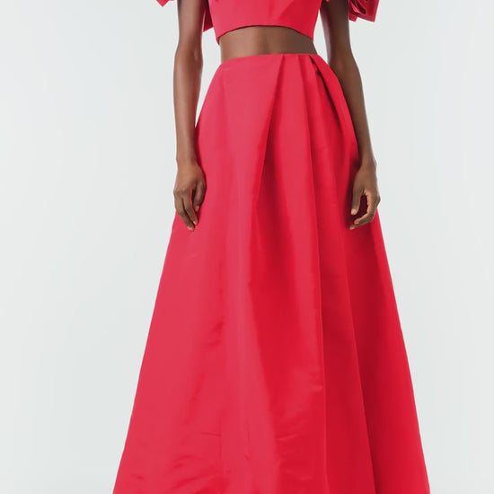 Monique Lhuillier Fall 2024 scarlet faille, off the shoulder, cropped bandeau top with bow sleeves - video.