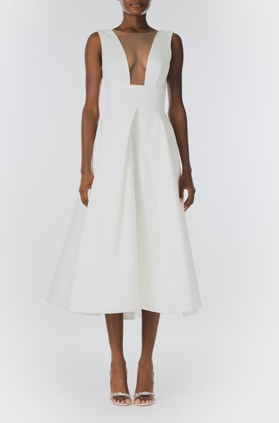 Monique Lhuillier "Kennedy" V-neck cocktail dress in Silk White Mikado fabric with pockets and nude illusion tulle at neckline - video.