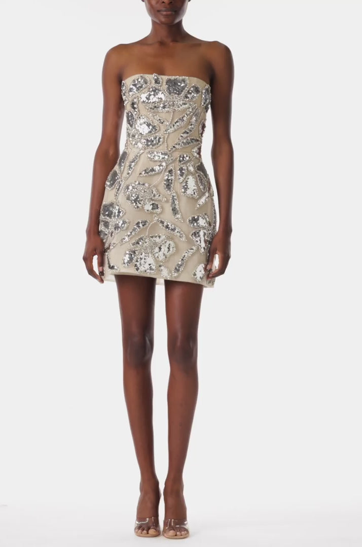 Monique Lhuillier strapless cocktail dress with structural skirt and silver metallic embroidery.