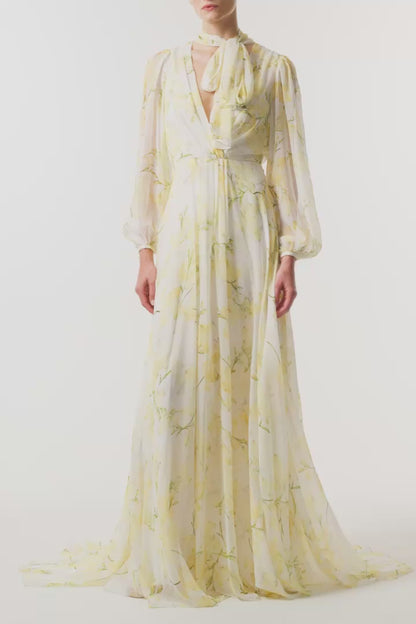 Monique Lhuillier Fall 2026 Pale Yellow/Multi Snapdragon Floral Printed Chiffon Draped V-neck long sleeve gown with blouson sleeves - video.