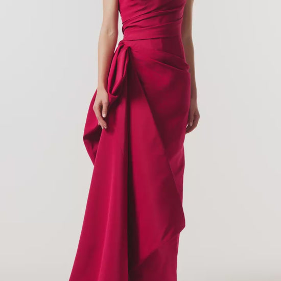 Monique Lhuillier Fall 2026 silk faille red strapless asymmetric draped column gown with side train - video