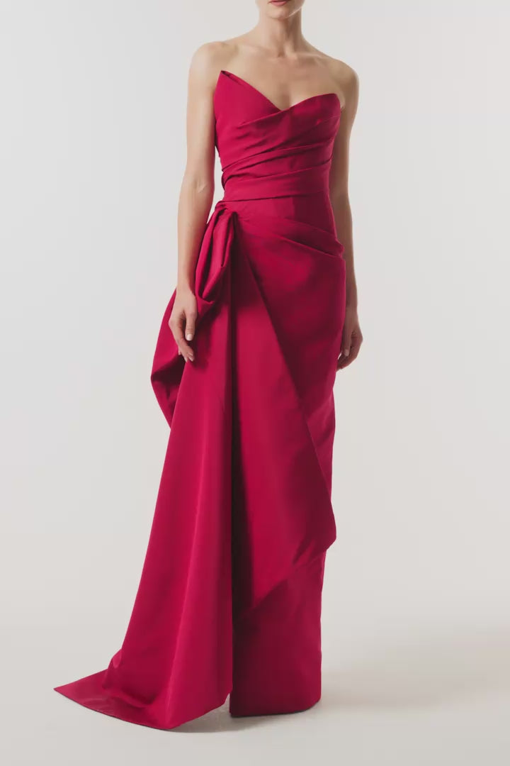 Monique Lhuillier Fall 2026 silk faille red strapless asymmetric draped column gown with side train - video