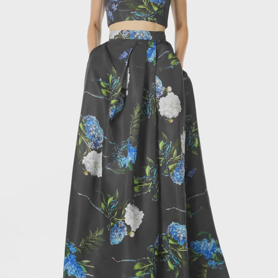 Monique Lhuillier Fall 2024 Pleated ball skirt with pockets and high front leg slit in Night Sky Hydrangea Printed Gazar - video.