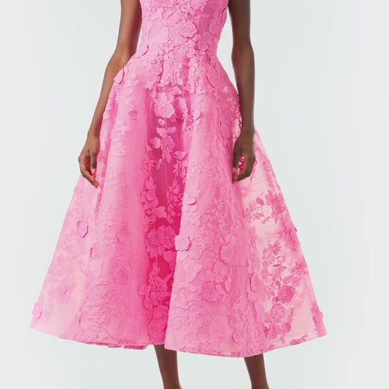 Monique Lhuillier Fall 2024 tea-length, strapless dress in pink 3D lace with full skirt and fitted sweetheart bodice - video.