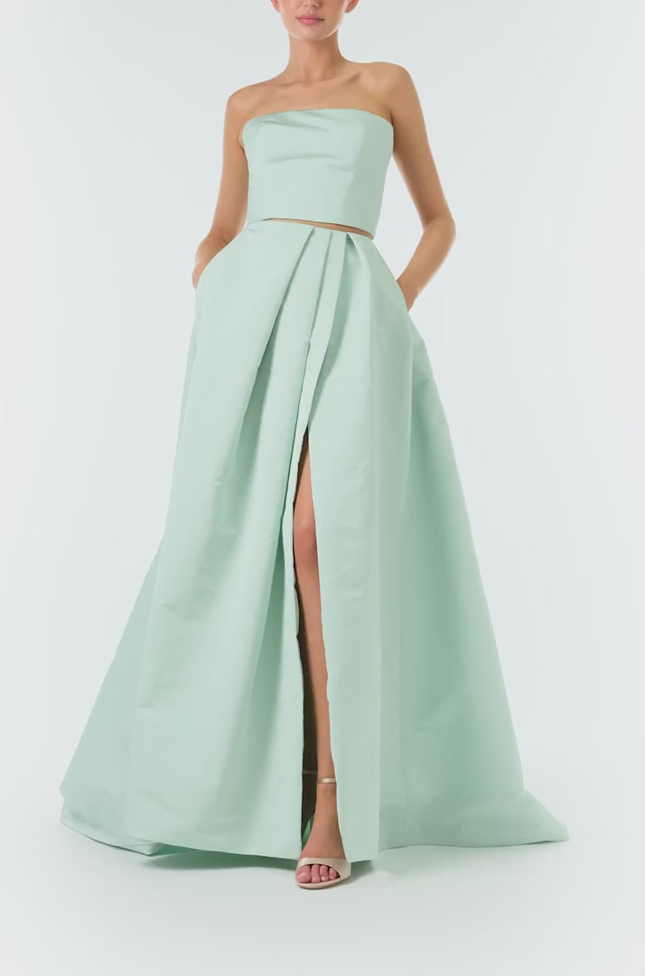 Monique Lhuillier Spring 2023 ball skirt with front slit in pistachio silk faille fabric - video.
