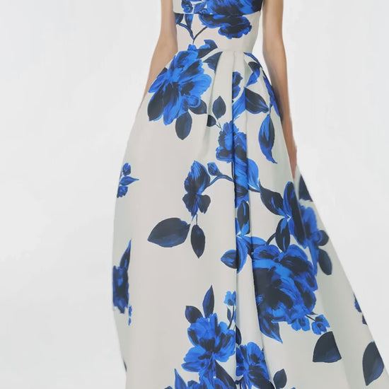 Monique Lhuillier Spring 2025 strapless ballgown with pockets, draped bodice and high leg slit in nautical blue & silk white rose printed gazar - video.