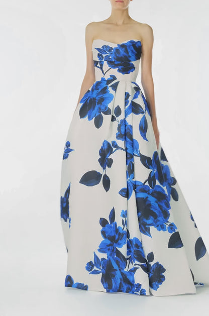 Monique Lhuillier Spring 2025 strapless ballgown with pockets, draped bodice and high leg slit in nautical blue & silk white rose printed gazar - video.