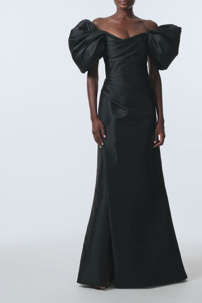 Monique Lhuillier Spring 2026 Noir Stretch Mikado draped sleeve floor-length off-the-shoulder gown - video.