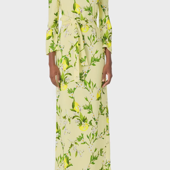 Monique Lhuillier Spring 2025 Lemon printed crepe sheath dress with jewel neckline, self-tie sash and bracelet-length long sleeves - video.