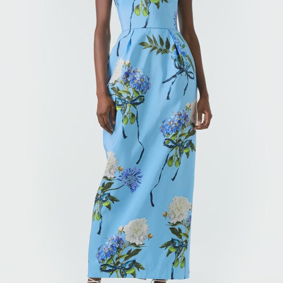 Monique Lhuillier Spring 2024 column gown with bateau neckline, cap sleeves and pockets in Sky Blue Hydrangea printed silk faille - video.