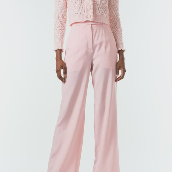 Monique Lhuillier Fall 2024 long sleeve, cropped bobble cardigan in Pale Blush wool cable knit - video.