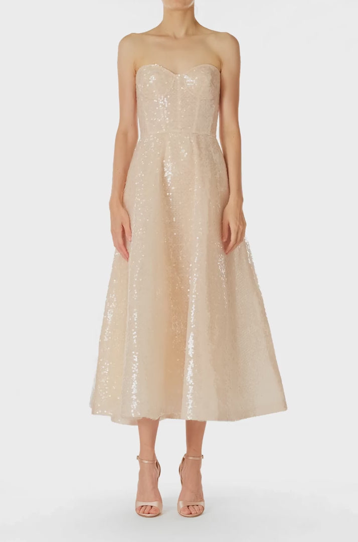 Monique Lhuillier Spring 2025 strapless, tea-length dress with sweetheart neckline in prosecco colored sequins - video.