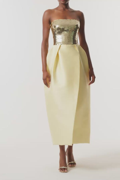 Monique Lhuillier Fall 2026 strapless midi dress with Gold sequin bodice and Pale yellow tulip cut Mikado Piqué skirt - video.