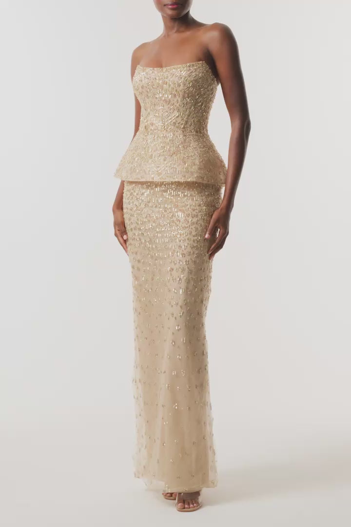 Monique Lhuillier Fall 2026 gold embroidered tulle strapless structured peplum column gown - video.