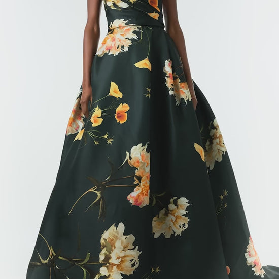 Monique Lhuillier Fall 2024 Strapless, V-neck ballgown with draped bodice, full skirt and pockets in Juniper Floral Print Gazar - video.