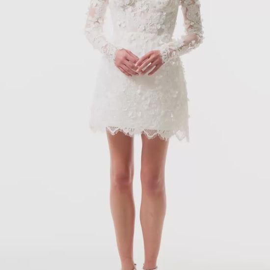Long sleeve, off the shoulder mini dress in silk white reembroidered lace - video.
