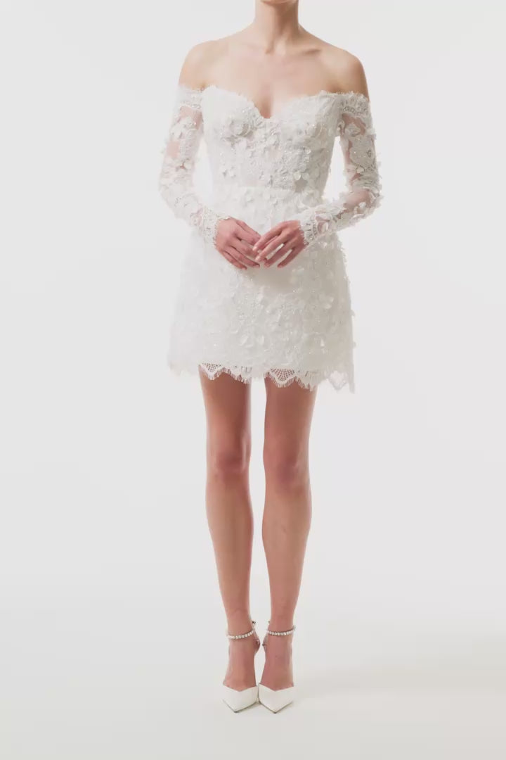 Long sleeve, off the shoulder mini dress in silk white reembroidered lace - video.