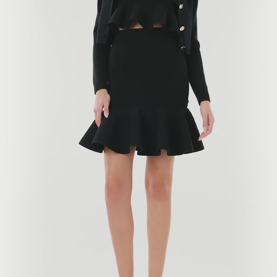 Monique Lhuillier black knit ruffle mini skirt.