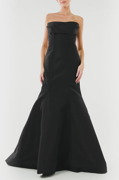 Monique Lhuillier noir strapless, faille evening gown with draped bodice and mermaid skirt.