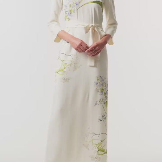 Monique Lhuillier Spring 2026 Ivory/Multi Iris Printed Crepe Bracelet sleeve sheath dress with belt - video.