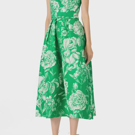 Monique Lhuillier Spring 2025 Strapless, tea-length dress with draped bodice and pockets in Grass/Silk White Floral Toile print - video.