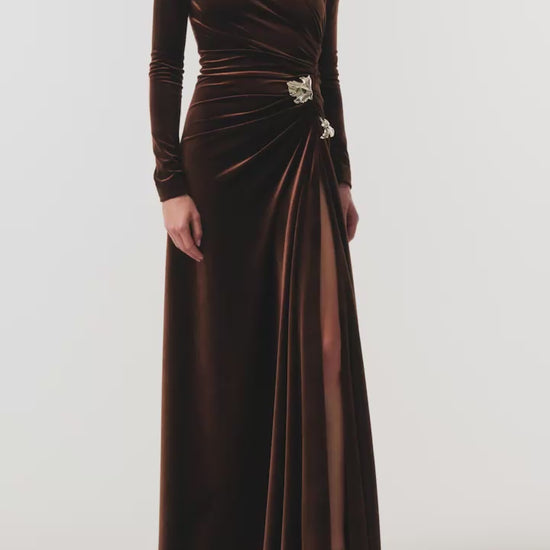 Monique Lhuillier Fall 2026 Café brown stretch velour high neck long sleeve gown with slit and gold floral embellishment - video.