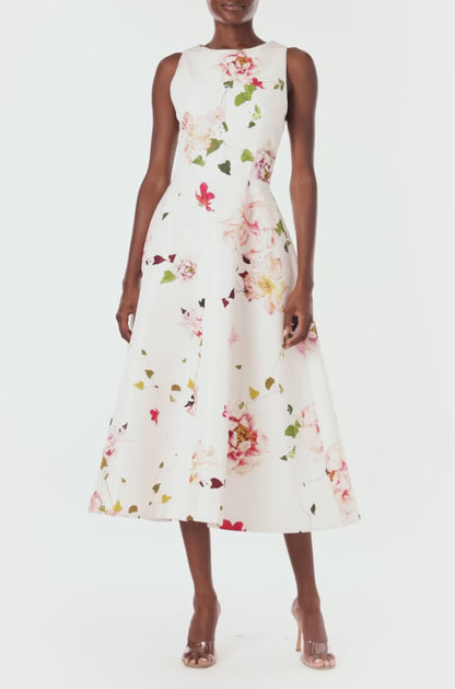 Monique Lhuillier sleeveless midi dress with jewel neckline and pockets in silk white floral printed silk faille.