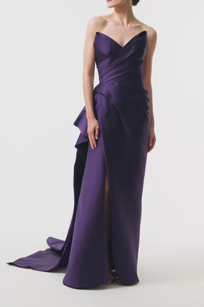 Monique Lhuillier Fall 2025 floor length gown with draped bodice and front leg slit in violet mikado fabric - video.
