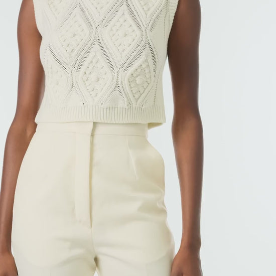 Monique Lhuillier Fall 2024 sleeveless, bobble crop tank in Creme wool cable knit - video.