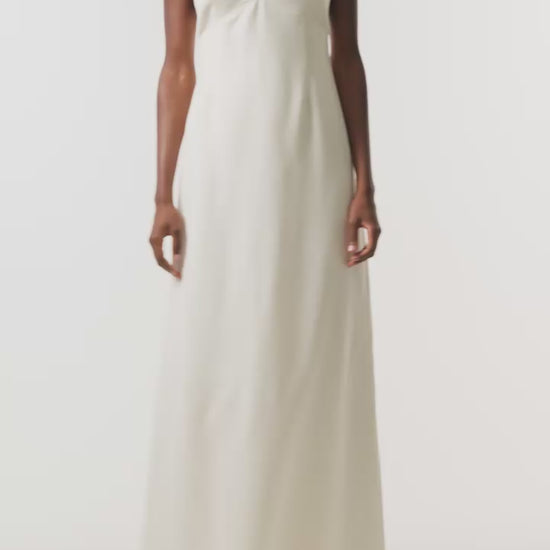 Monique Lhuillier Spring 2026 Ivory Lightweight Silk Wool Suiting A - line V -neck gown with pearl ball straps - video.