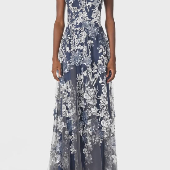 Monique Lhuillier sleeveless, sequin tulle gown with illusion neckline and slight high-low hem in navy multi colors - video.