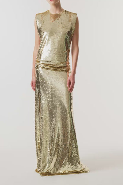 Monique Lhuillier Fall 2026 Gold Sequin to piece Sleeveless top with floral embellishment and evening skirt - video.