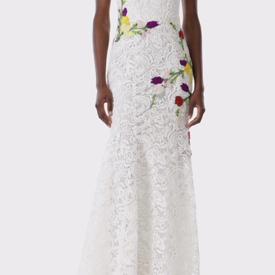 Monique Lhuillier white lace strapless gown with floral embroidery.