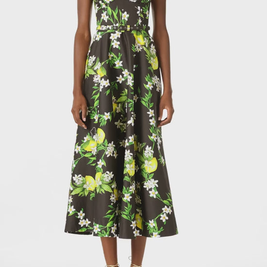 Monique Lhuillier Spring 2025 A-line midi dress with spaghetti straps, corseted bodice and pockets in Lemon printed cotton poplin - video.