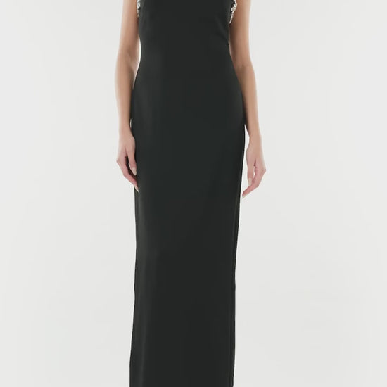 Monique Lhuillier noir sleeveless, crepe evening gown with jewel neckline and crystal embroidery detail.
