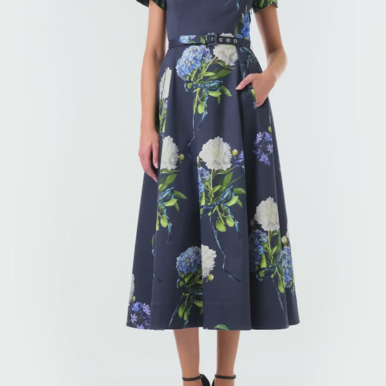 Monique Lhuillier Fall 2024 night sky floral collared, short sleeve dress with pockets, belted waist and midi a-line skirt - video.