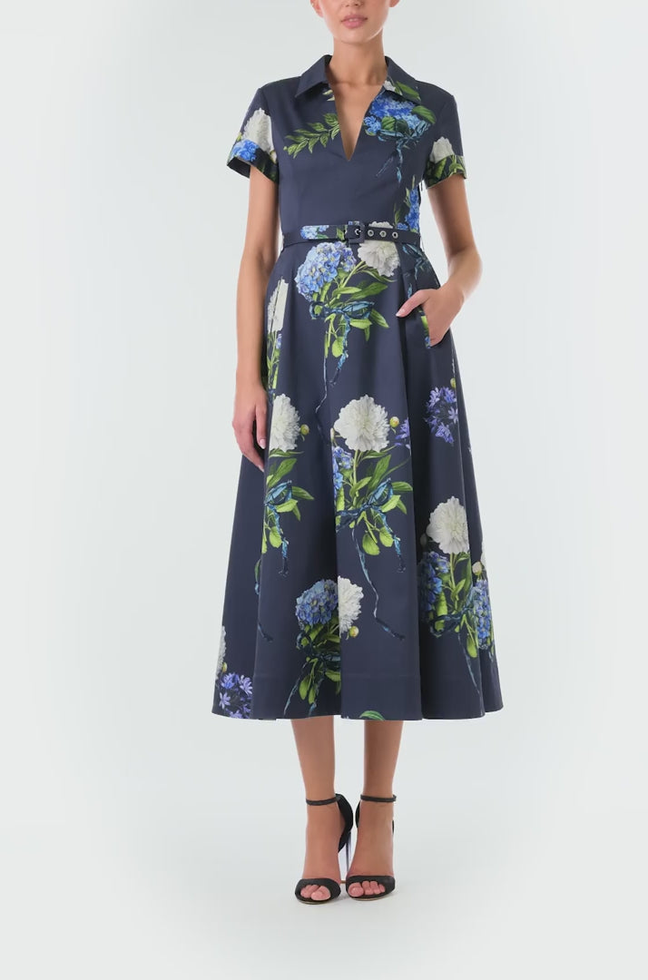 Monique Lhuillier Fall 2024 night sky floral collared, short sleeve dress with pockets, belted waist and midi a-line skirt - video.