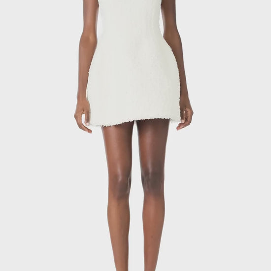 Monique Lhuillier Spring 2025 Scoop neck dress with short, sculpted skirt in Silk White Cotton Tweed - video.