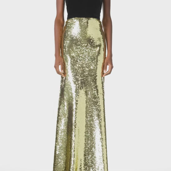 Monique Lhuillier Fall 2024 strapless sequin evening gown in gold sequins with noir velvet bodice and train - video.