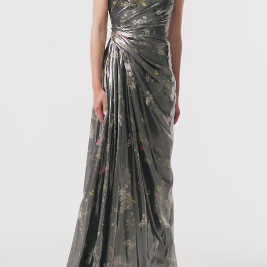 Monique Lhuillier Fall 2025 strapless gown with detached neck scarf in metallic floral printed lame fabric - video.